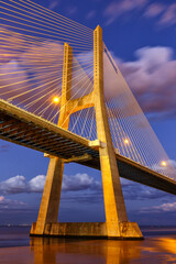 Lisbon Portugal bridge Ponte Vasco da Gama over Tejo river town travel portrait format