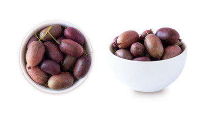 Actinidia isolated on white background. Actinidia in a bowl with copy space for text. Kiwi fruit actinidia. Baby kiwi fruits in a bowl from different angles.Top view