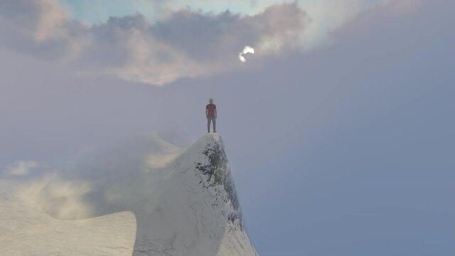 Man on a high peak of a mountain surrounded in fog