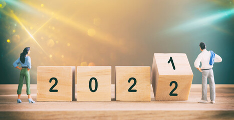 wooden cubes with the text 2022 over bright shiny background