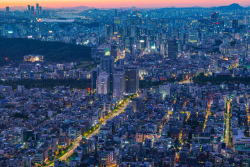 Seoul city night view from the top of the mountain at sunset time