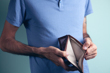 a man holding an empty wallet