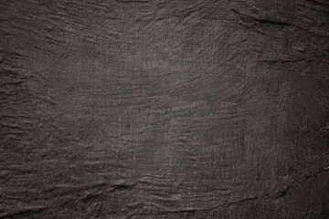 Empty black background with concrete texture, copy space