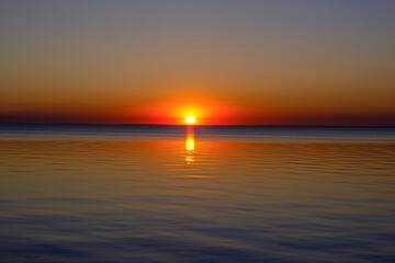 Fototapeta na wymiar sunset on the background of the sea