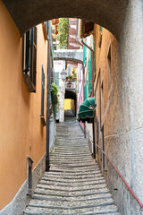 Vintage narrow street of Varenna town at lake Como in Lombardy region