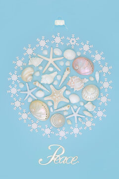 Peace At Christmas In Summer Concept With Abstract Round Bauble Tree Decoration With Sea Shells, Snowflake And Symbols On Blue. Festive Design For Alternative Holiday Season For Southern Hemisphere.