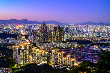 Seoul city night view from the top of the mountain at sunset time
