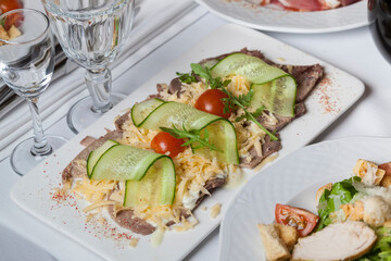 grated classic cheese grated with sliced cucumbers