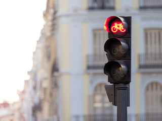 Red traffic light on the street.