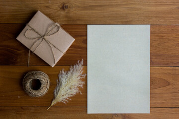 Vintage letter envelop with flower on wooden table.
