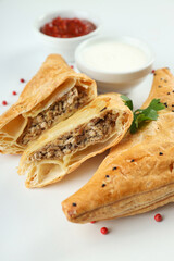 Concept of tasty food with samsa on white background