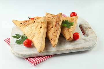 Concept of tasty food with samsa on white background