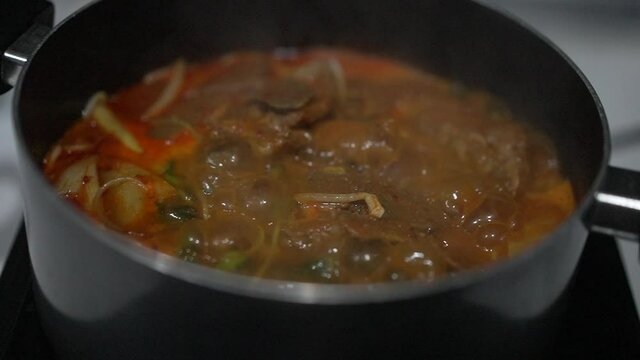 slow motion Boiled  hot and spicy meat soup Korean style 