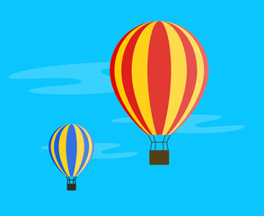 Obraz premium Two hot air balloons flying in blue sky