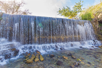 An amazing waterfall in the famous Sahna - gan hashlosha Nature Reserve, near Kibbutz Nir David, Israel