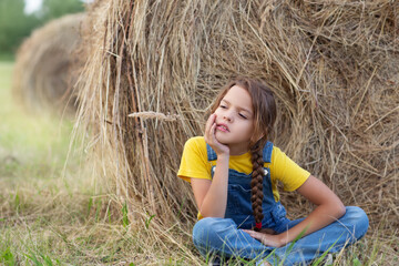 girl on hay bale