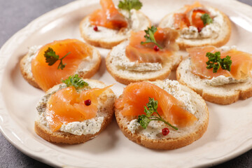 canape, buffet food, bread toast with cream cheese and smoked salmon