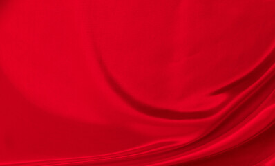 Black red satin dark fabric texture luxurious shiny that is abstract silk cloth background with patterns soft waves blur beautiful.