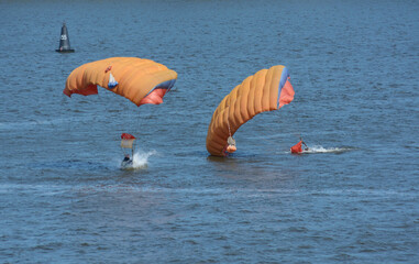 Two military parachutists landing on water, paratroopers training