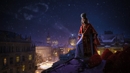 Saint Nicholas - Sinterklaas - Dutch Santa on top of the roof of night winter cityview. High...
