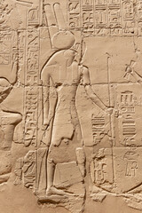 Ancient Egyptian murals and writings on the stone walls of the Karnak Temple in Luxor