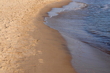 Soft wave of the sea on the sandy beach.Soft focus,blurred image.