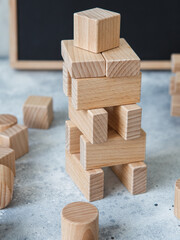 Wooden Toy Construction with ecologically wooden blocks manufactured from sustainable timbers. Wood elements for kids mental development and education. Montessori toy