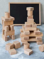 Wooden Toy Construction with ecologically wooden blocks manufactured from sustainable timbers. Wood elements for kids mental development and education. Montessori toy