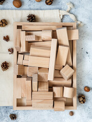 Wooden Toy Construction with ecologically wooden blocks manufactured from sustainable timbers. Wood elements for kids mental development and education. Montessori toy