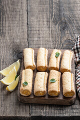 Homemade lemon cookies on wooden table