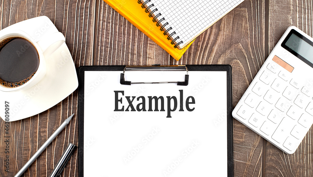 Poster example text on paper with coffee, calculator and notebook. business concept