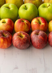 apples assortment in row, multicoloredm vertical shot, copy space