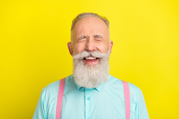 Photo of funny beard senior man laugh wear blue shirt isolated on vivid yellow color background