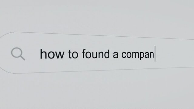 How to found a company - Pc screen internet browser search engine bar typing business related question.