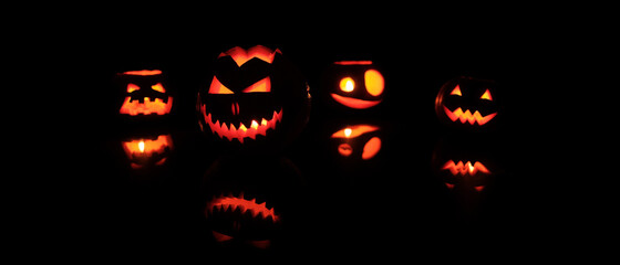 Many Different Halloween Head Jack Pumpkins with Scary Smile and Burning Candle Inside for Party Night on Black Background
