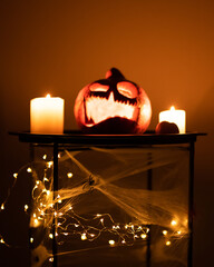 Head Jack Pumpkin with Scary Smile and Candles for Party Night on Black Background, Halloween Concept