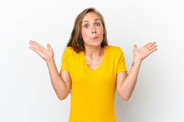 Fototapeta premium Young caucasian woman isolated on white background making doubts gesture
