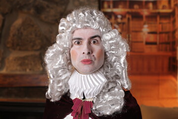 Gallant man wearing white wig and vintage renaissance look