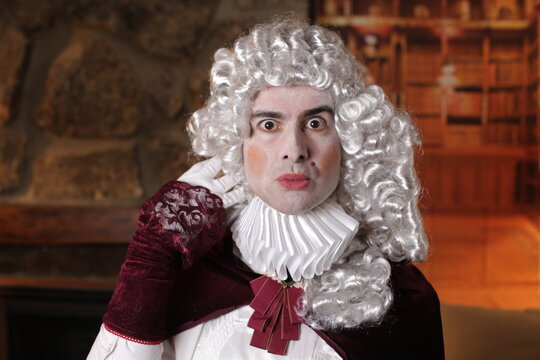 Gallant man wearing white wig and vintage renaissance look