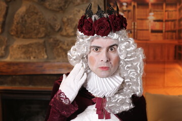 Gallant man wearing white wig and vintage renaissance look