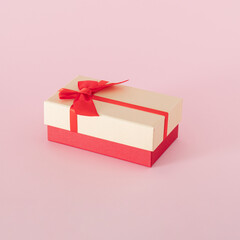 gift box for christmas and new year against pink background. creative decoration idea. minimalism.