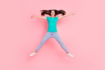 Full length photo of young excited woman happy positive smile have fun jump fly isolated over pastel color background
