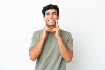 Young Argentinian man isolated on white background smiling with a happy and pleasant expression