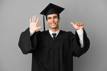 Young Argentinian university graduate isolated on grey background counting six with fingers