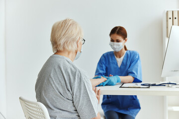 Fototapeta premium elderly woman and doctor Hospital visit treatment