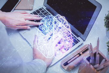 Fototapeta premium Multi exposure of woman hands working on computer and brain hologram drawing. Ai concept.