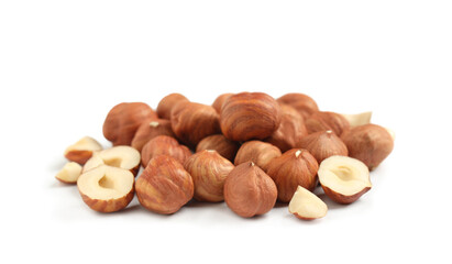 Heap of tasty hazelnuts on white background