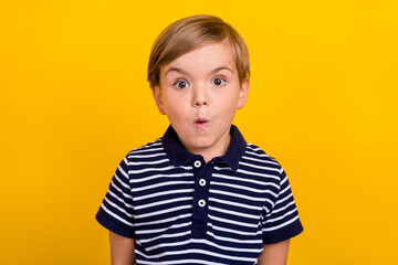 Photo portrait little boy wearing casual clothes staring amazed isolated bright yellow color background