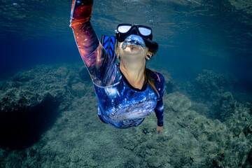 Female snorkeling in the Mediterranean during summer in between France and Monaco 