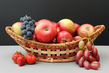 fruit and berry basket: apples, grapes, strawberries